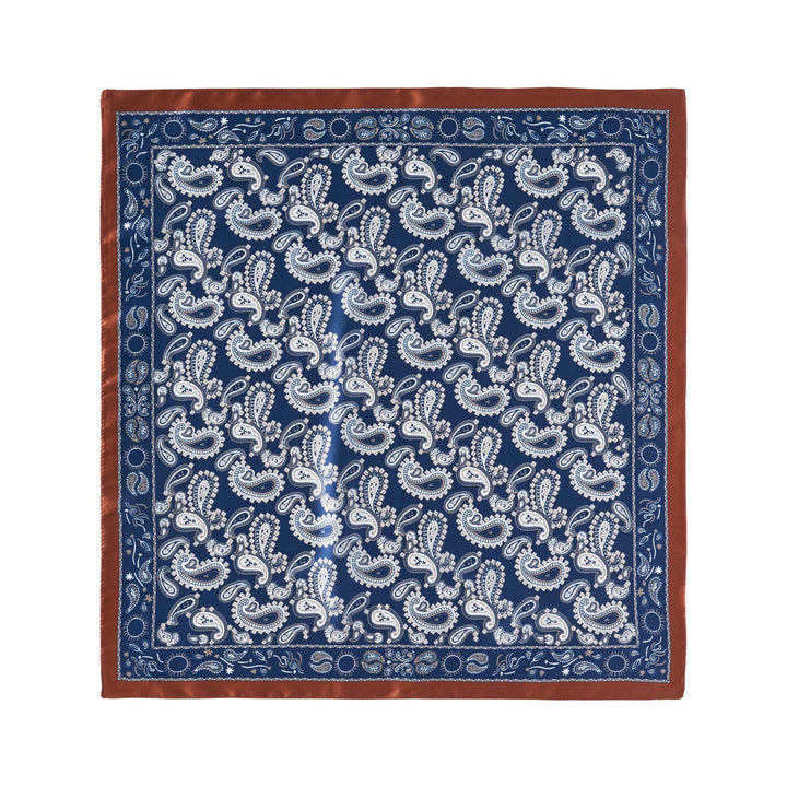 A Paisley Series Square Silk Scarf by SusanSilk, featuring a blue background with a white paisley pattern and bordered by a brown edge.