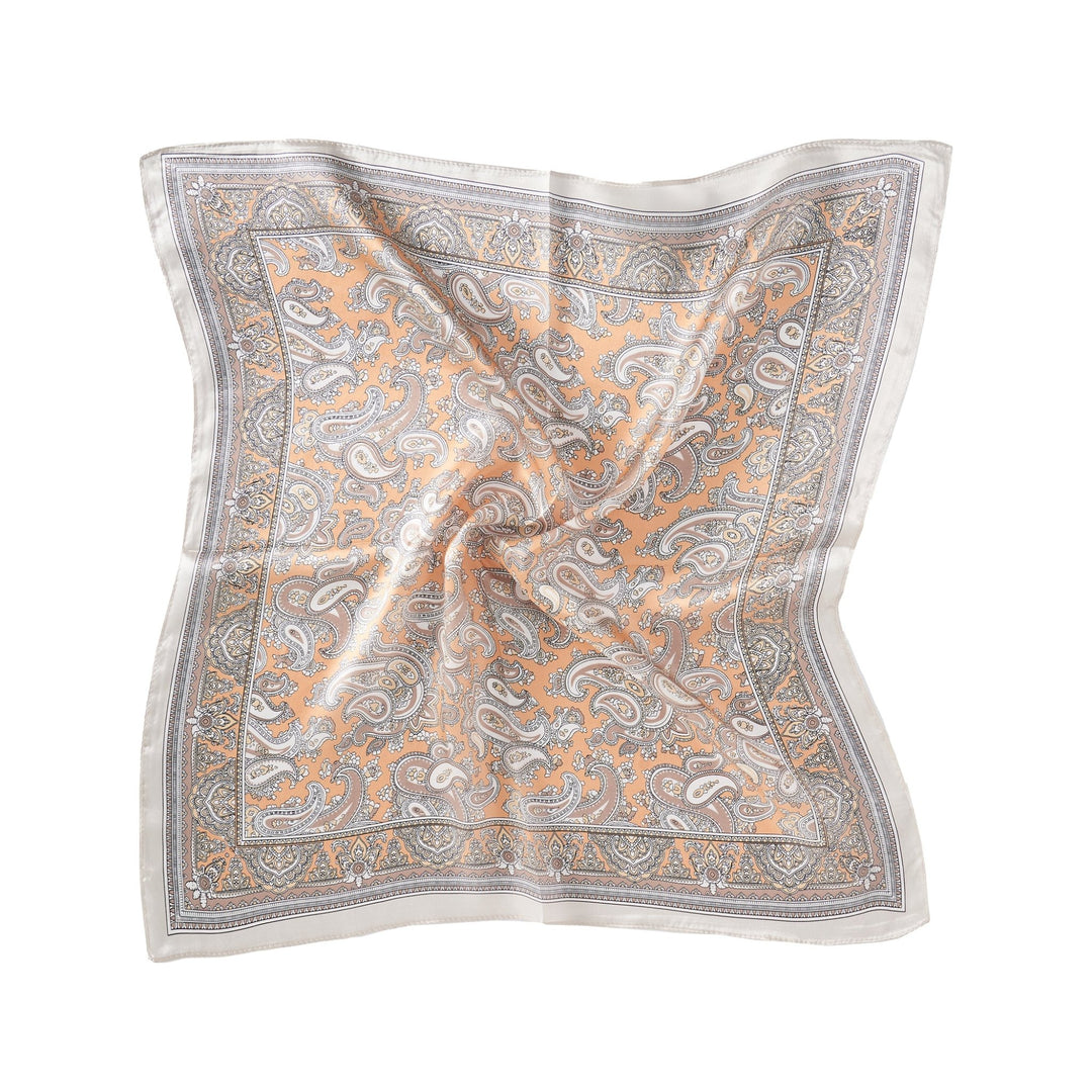 The Paisley Series Square Silk Scarf by SusanSilk, featuring an intricate paisley pattern in shades of peach, grey, and white, lies flat with slight folds.