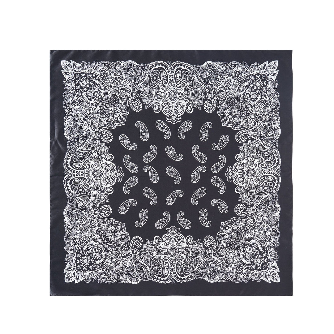 The SusanSilk Paisley Series Square Silk Scarf showcases a sophisticated black silk fabric adorned with an intricate white paisley pattern and a detailed ornamental border design, making it the perfect standout accessory.