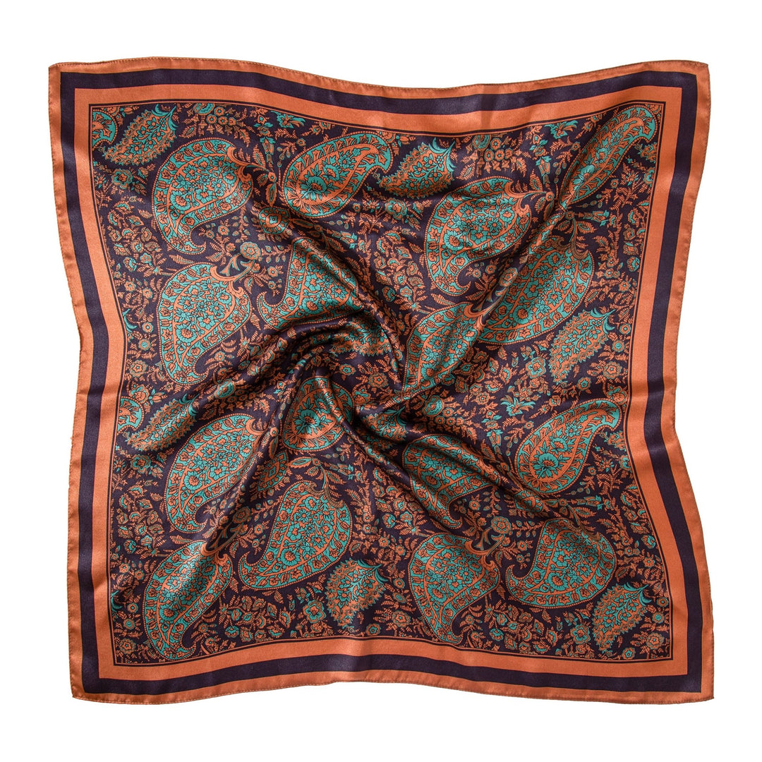 Introducing the Paisley Square Silk Scarf - Retro by SusanSilk, a luxurious square scarf adorned with an intricate paisley pattern in shades of teal and red on a dark background, finished with a stylish striped red and black border.