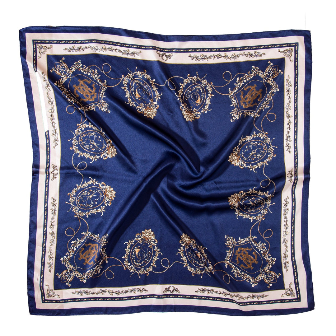 A Royal Pattern Square Silk Scarf by SusanSilk in blue, featuring an ornate gold and white design with intricate patterns and framed motifs.